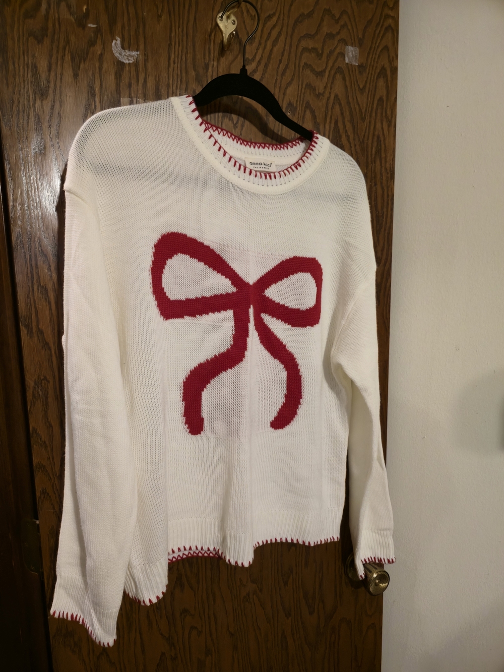 Cream Knit Sweater with Red Bow Accent